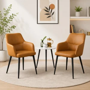 Tan leather dining chairs with black metal legs in a modern living room